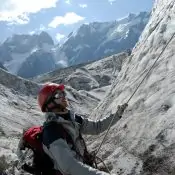 Young mountaineer is working out on a glacier during training courses. Mountaineering course in Nepal.