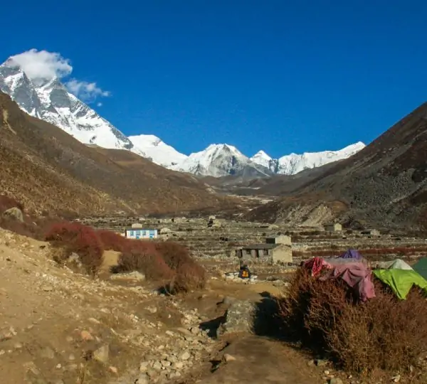 Panoramic view of distant snow-capped Himalayan mountains as seen from the Everest Base Camp trekking route.