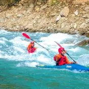 Two people paddling kayaks in kali gandaki river. Solo kayaking.
