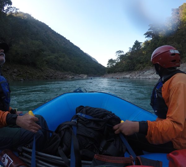 A group of rafters navigating the flowing waters of Karnali River