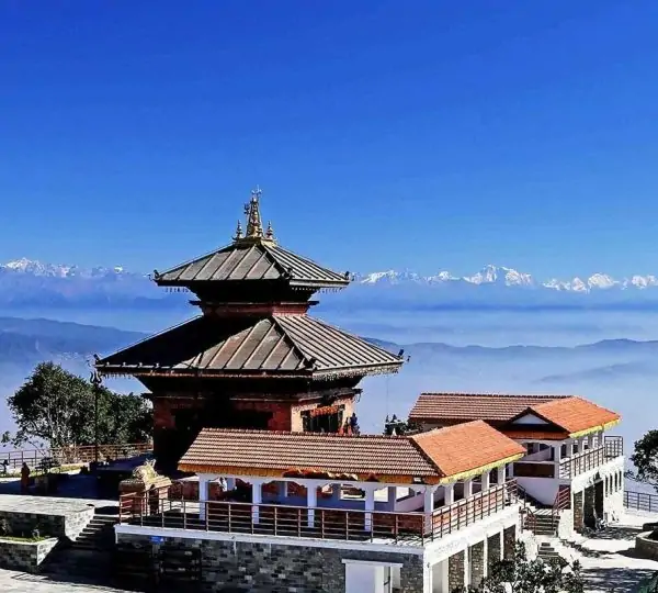Chandragiri Temple perched on a hilltop with the Himalayan mountain range visible in the background on a clear day in Nepal.