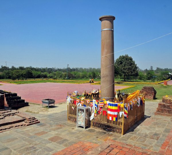 The Ashoka Pillar standing near the Maya Devi Temple in Lumbini, Nepal, commemorating the birthplace of Lord Buddha.