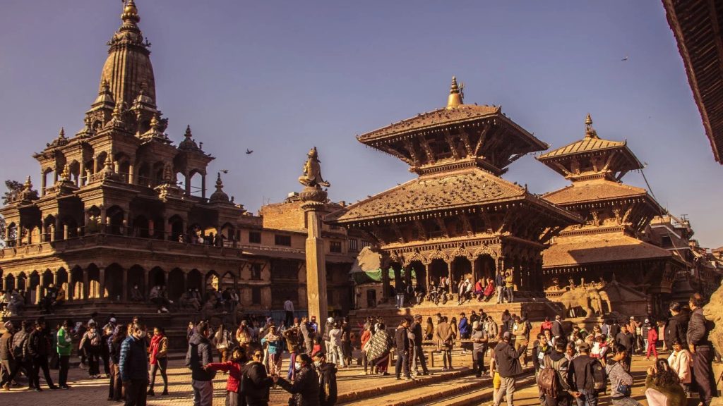 Historic Patan Durbar Square showcasing traditional Newari temples and palace structures in Kathmandu Valley, Nepal.