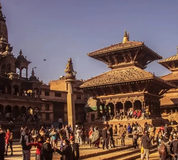 Historic Patan Durbar Square showcasing traditional Newari temples and palace structures in Kathmandu Valley, Nepal.