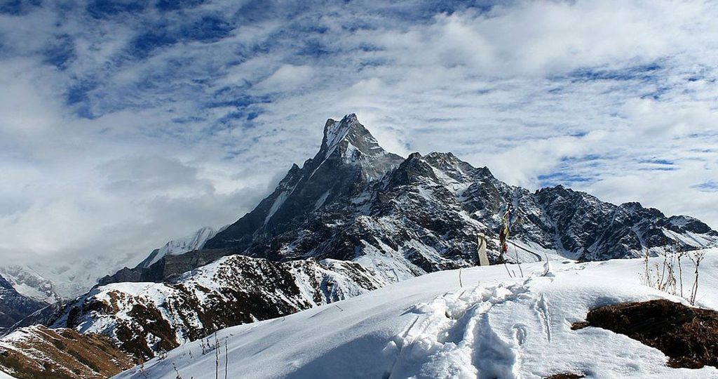 Trekking in Nepal during winter on the Mardi Himal Trek with snow-covered Himalayan mountains